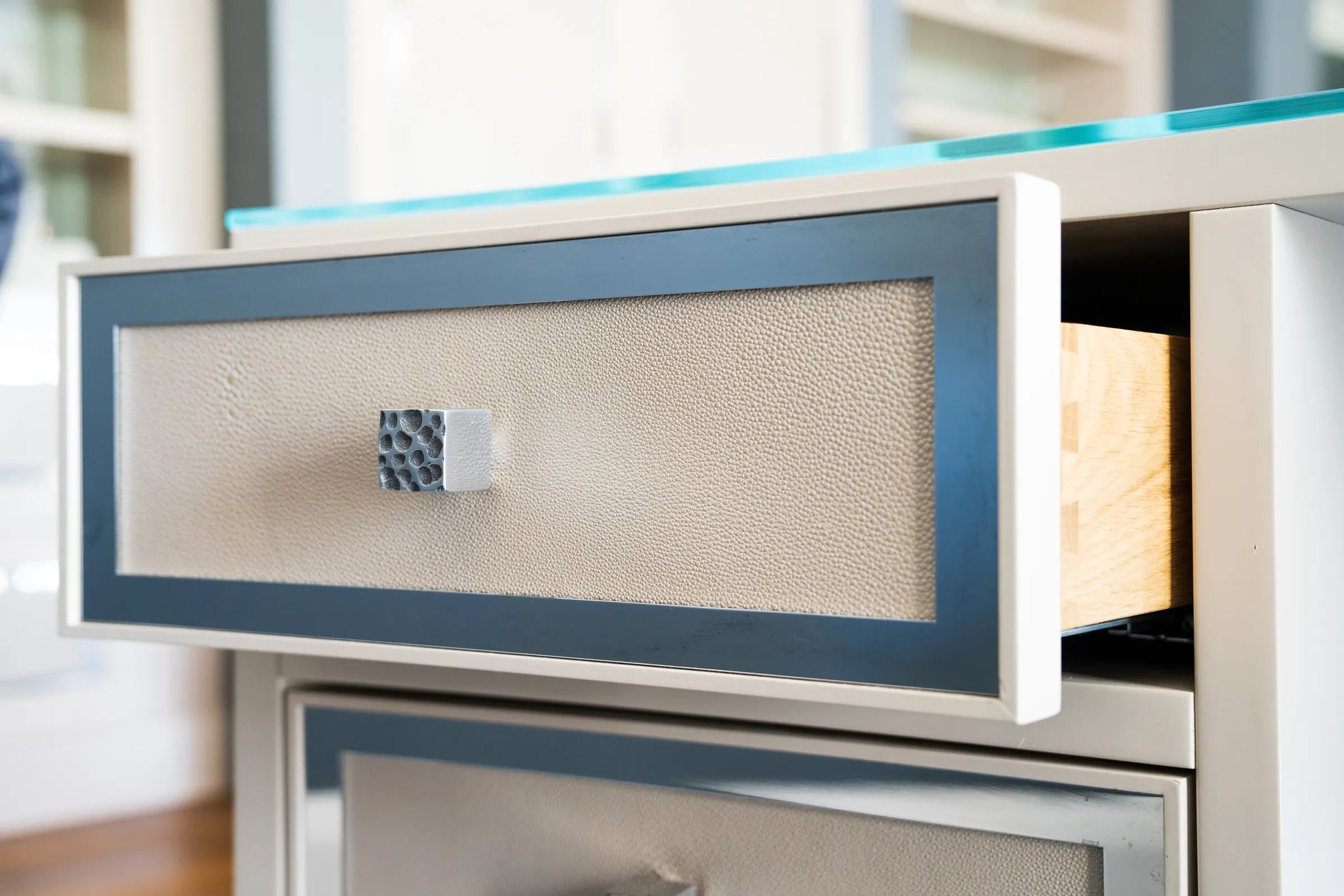 A shagreen drawer front with a faceted pull